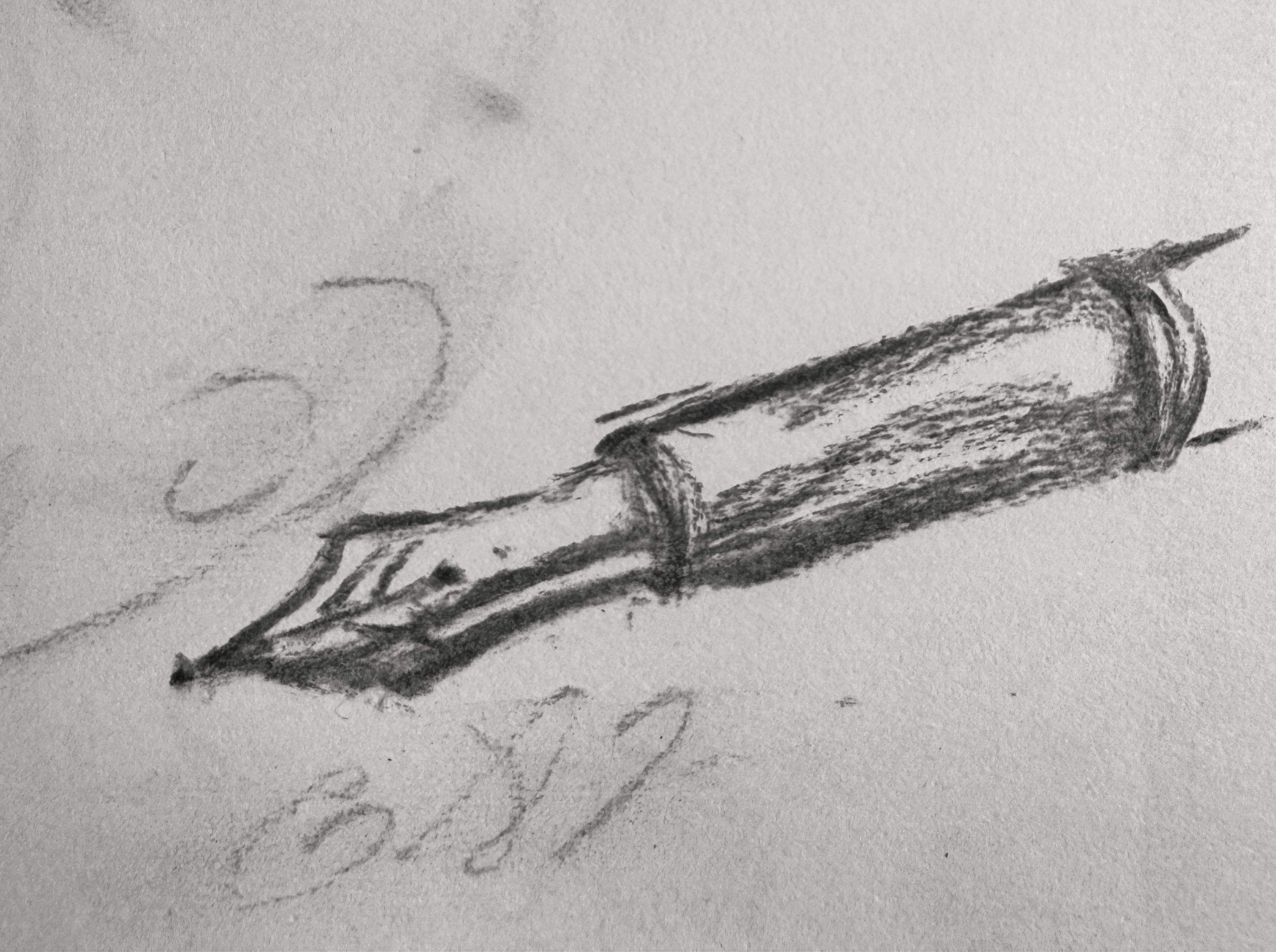 Charcoal drawing of an envelope and quill